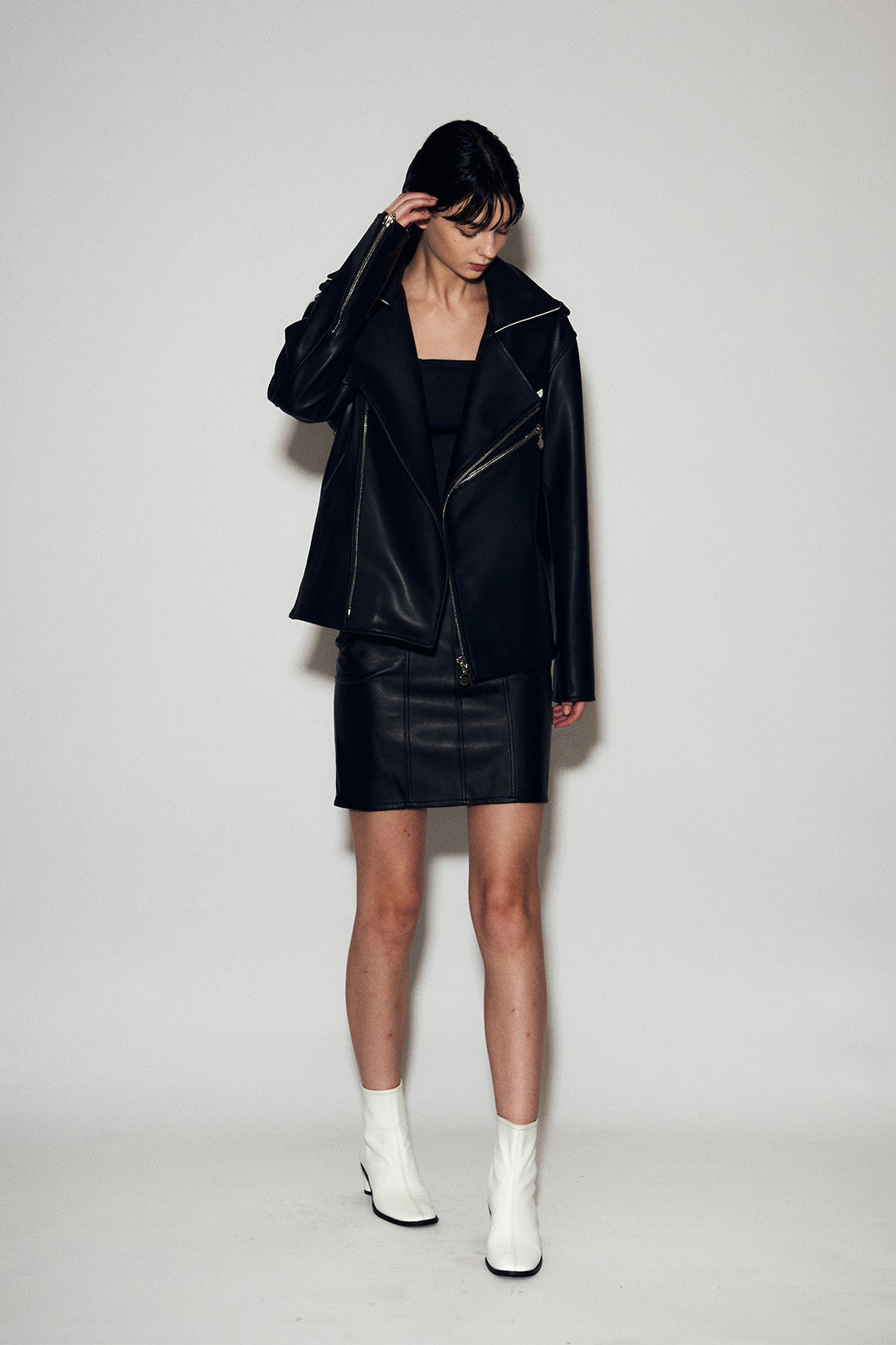 Black Lunecave cow skin loose-fit rider jacket, stylish motorcycle jacket with rugged leather texture and casual fit.