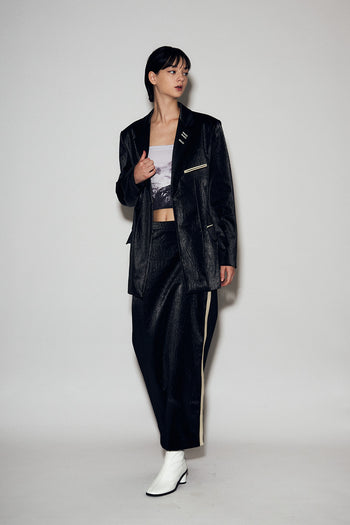 Black Eco Leather Loose-Fit Jacket by Lunecave, displayed on a hanger, featuring a relaxed fit and sleek design.
