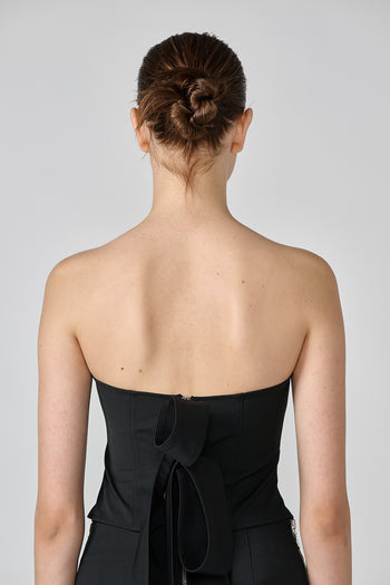 Black wool bustier top by Lunecave, featuring a fitted design and structured silhouette, displayed on a plain background.