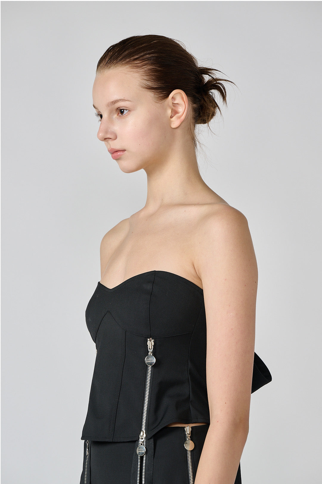 Black wool bustier top by Lunecave, featuring a fitted design and structured silhouette.