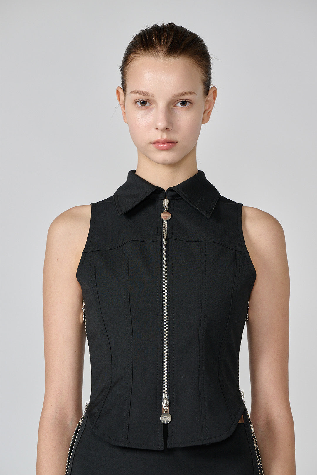 Black wool vest from Lunecave, a stylish top with a fitted design, displayed on a plain background.