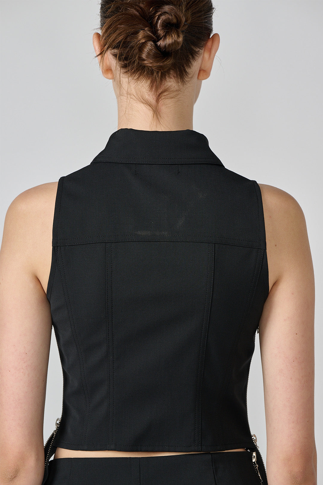 Black Lunecave wool vest, a stylish top with a cozy fit, shown on a plain background.