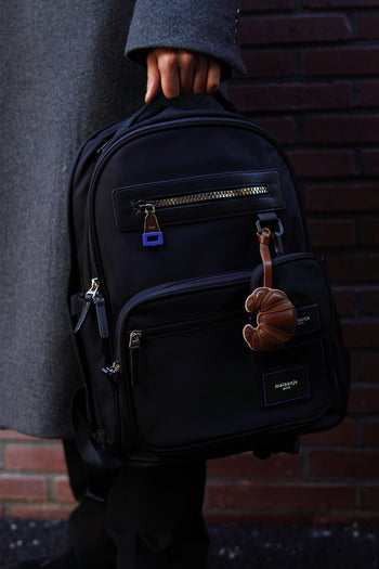Black MAISONJE Everyday Backpack bag with adjustable straps and multiple compartments, suitable for daily use.