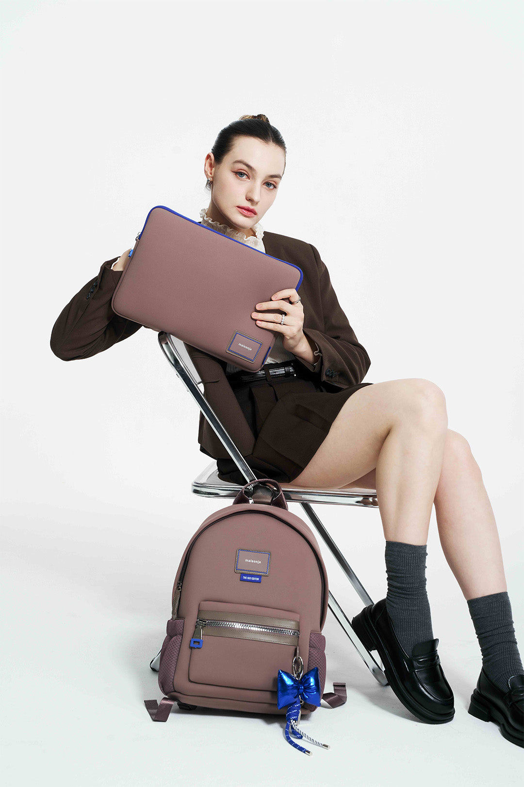 Black 13-inch MAISONJE My Petite Lady laptop case with sleek design and padded interior for laptop protection.