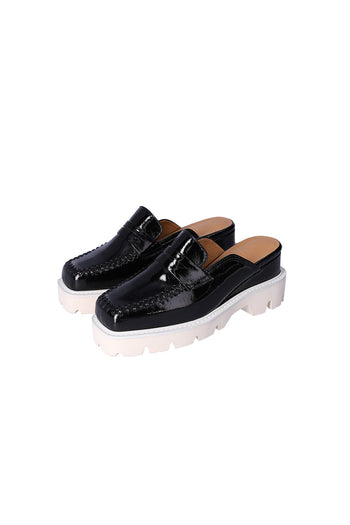 Nuosmiq Puka Platform Black Bloafers showing black loafers with platform soles and sleek design.