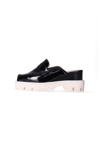 Nuosmiq Puka Platform Black loafers with chunky soles and sleek black leather, showcasing stylish footwear design.