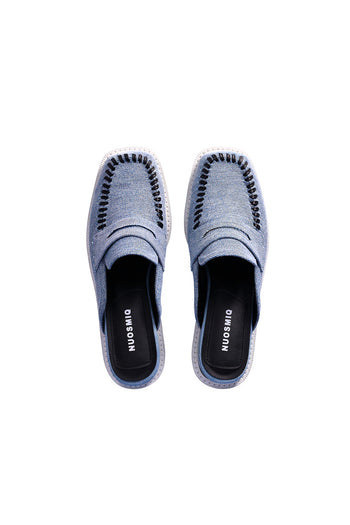 Nuosmiq Puka Platform Denim Bloafers showing blue denim fabric and stylish platform sole on a white background.