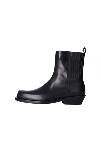 Black Rama Chelsea boots by Nuosmiq featuring sleek leather design and elastic side panels.