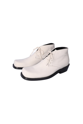 Nuosmiq Basa Chukka Ivory boots featuring smooth ivory leather and classic ankle-height design.