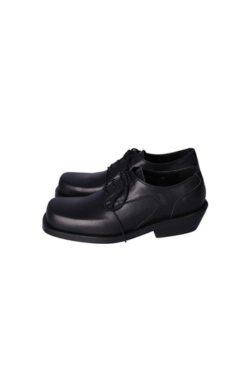 Nuosmiq Hardy Derby Black shoe showing sleek black leather upper and classic derby design on a neutral background.