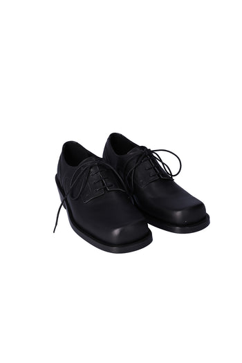 Nuosmiq Hardy Derby Black shoe with sleek black leather finish and classic derby design, displayed on a white background.