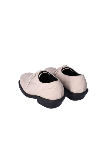 Nuosmiq Hardy Derby shoes in light beige leather, showing the classic derby style with laces and sleek design.