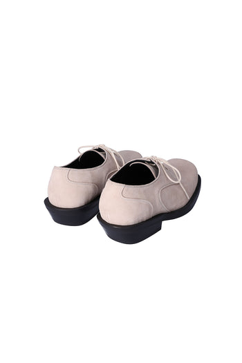 Nuosmiq Hardy Derby shoes in light beige leather, showing the classic derby style with laces and sleek design.