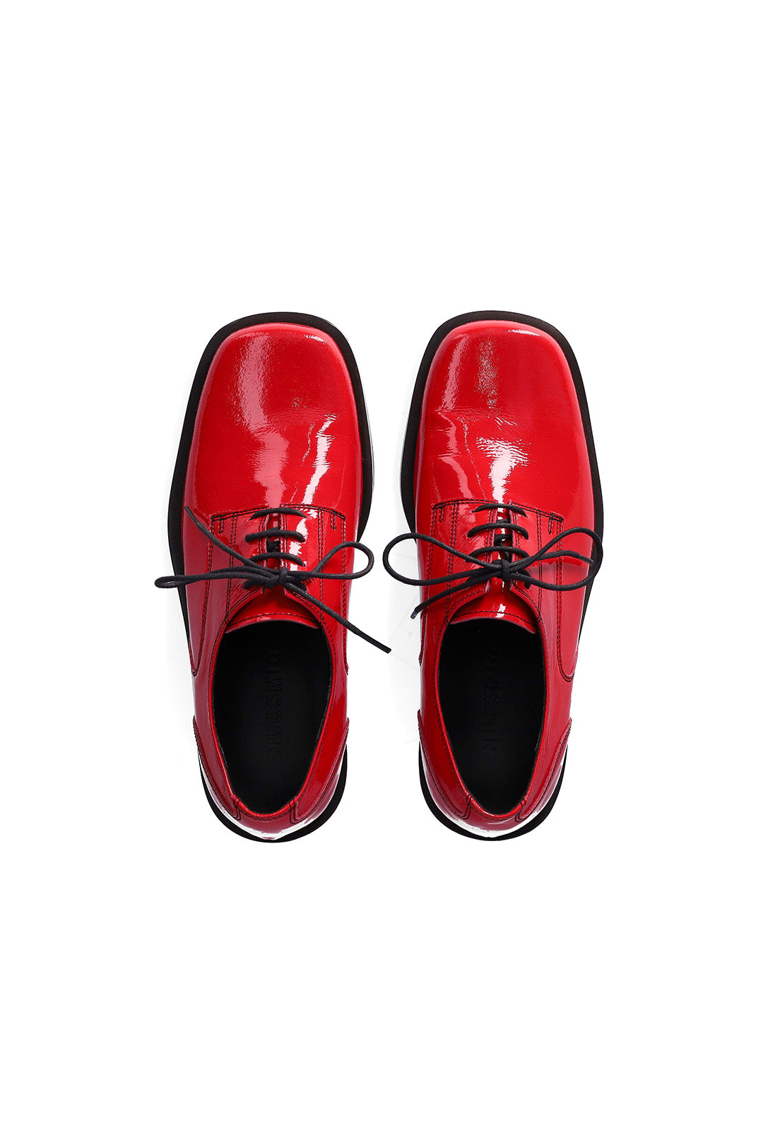 Nuosmiq Hardy Derby Red shoe showing red leather upper, lace-up design, and sleek silhouette for stylish casual wear.