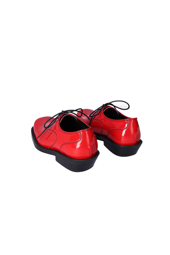 Nuosmiq Hardy Derby Red derby shoe with red leather upper and classic lace-up design, showcasing stylish footwear craftsmanship.