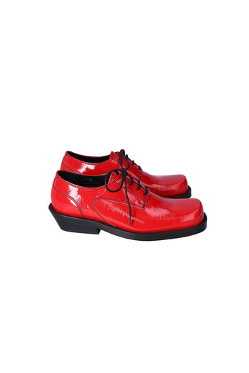 Nuosmiq Hardy Derby Red shoe, close-up of red leather derby style footwear with detailed stitching and classic design.