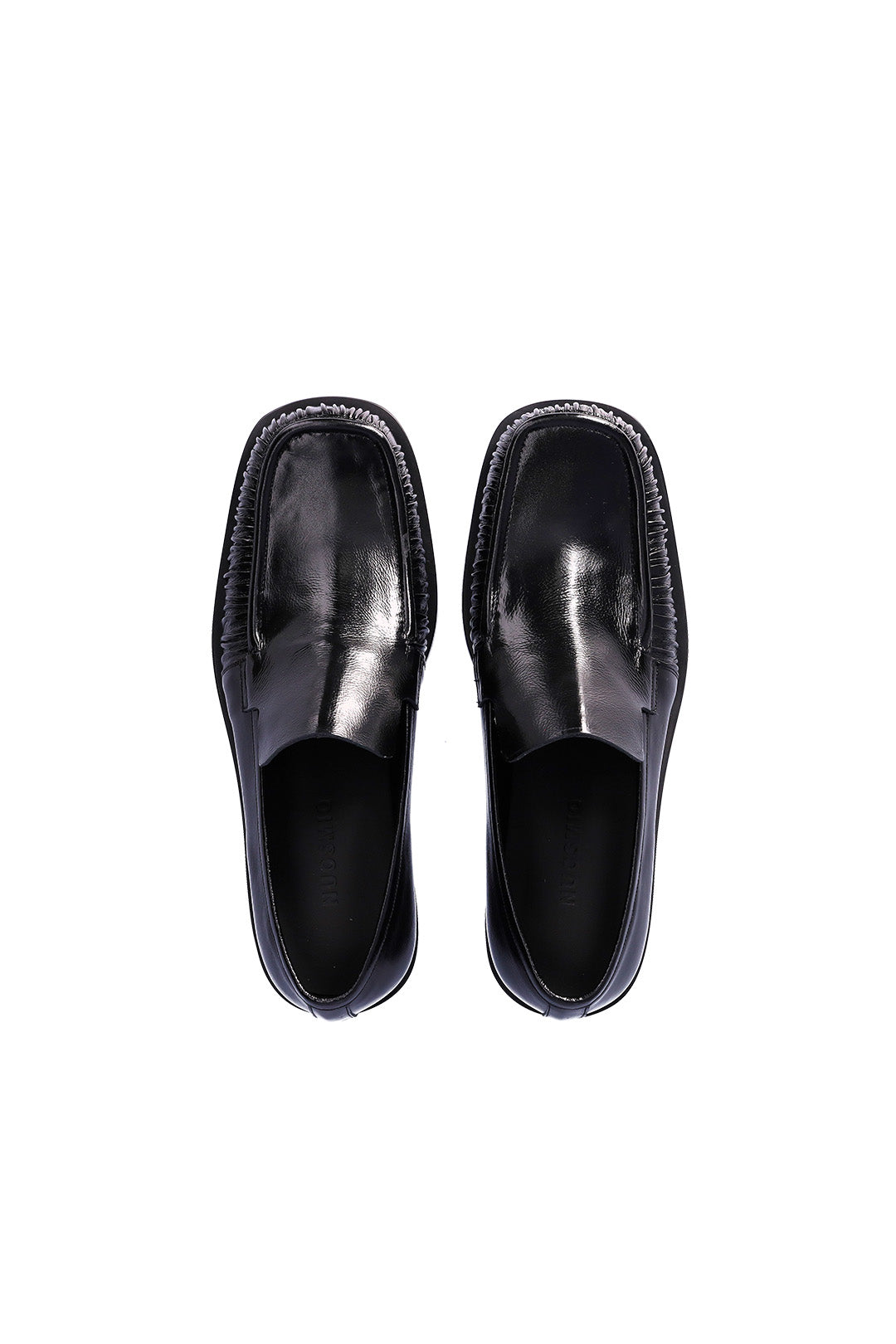 Nuosmiq Sina Winkle Black loafers with sleek leather design and classic stitching, displayed on a neutral background.