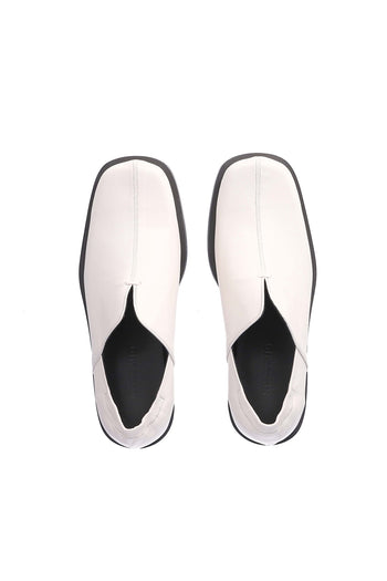 Nuosmiq Nujan Slips Ivory loafers with sleek design and smooth leather finish, displayed on a neutral background.