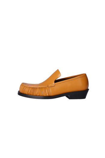 Nuosmiq Sina Winkle Mustard loafers in vibrant mustard yellow leather, featuring a sleek slip-on design for casual style.