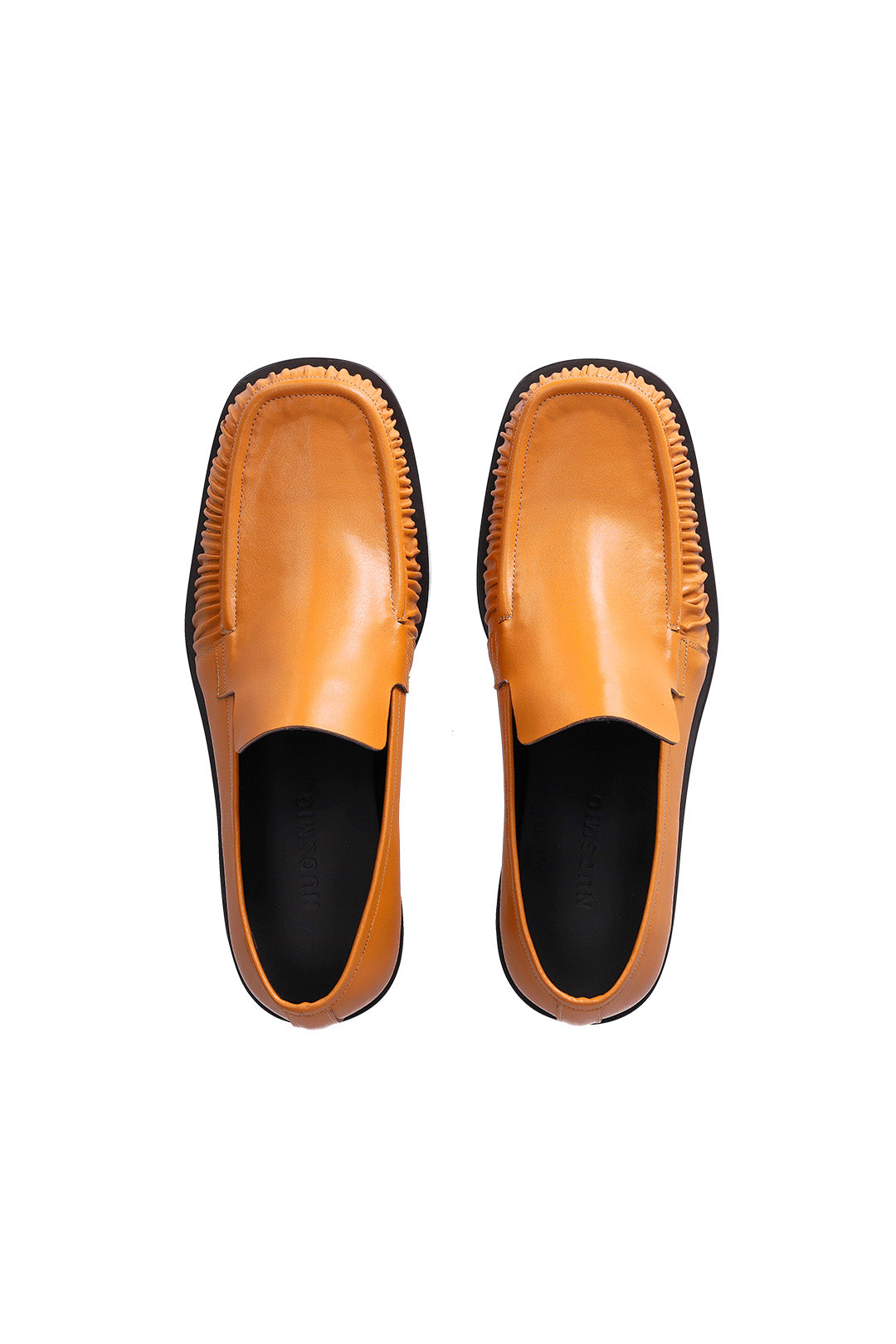 Nuosmiq Sina Winkle Mustard loafers in mustard yellow leather with slip-on design and stitching details.