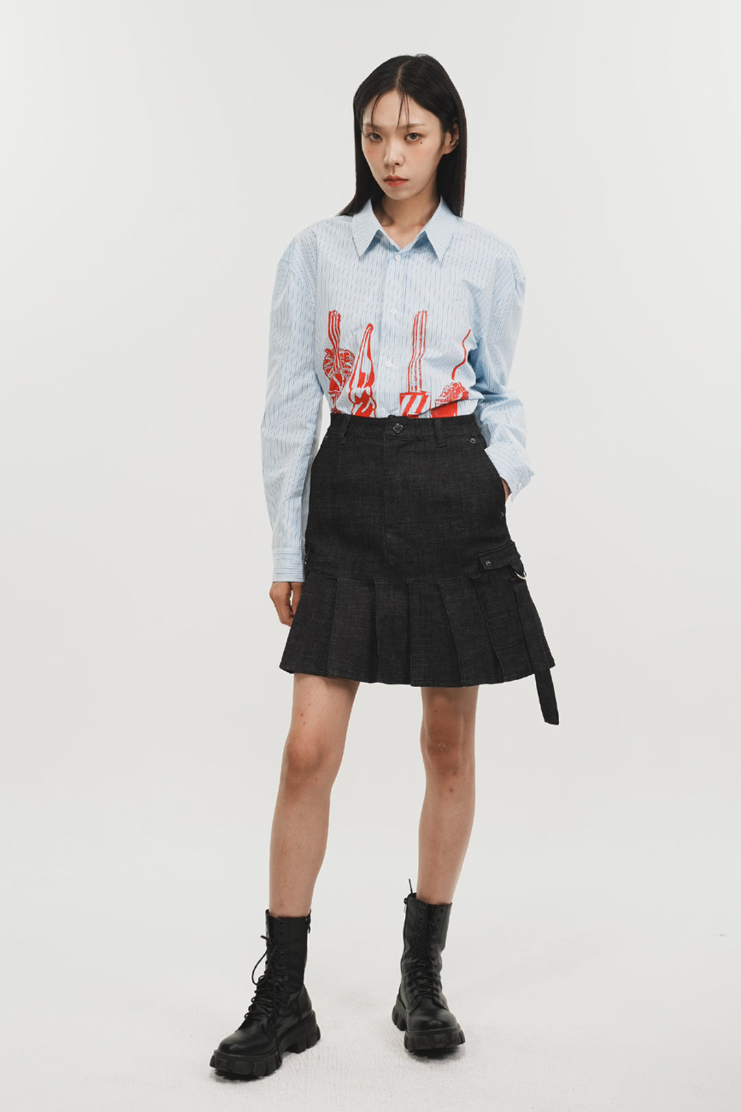 Charcoal denim pleated skirt by Phenomenon Seeper, featuring a stylish midi-length design with a flowy, pleated bottom.