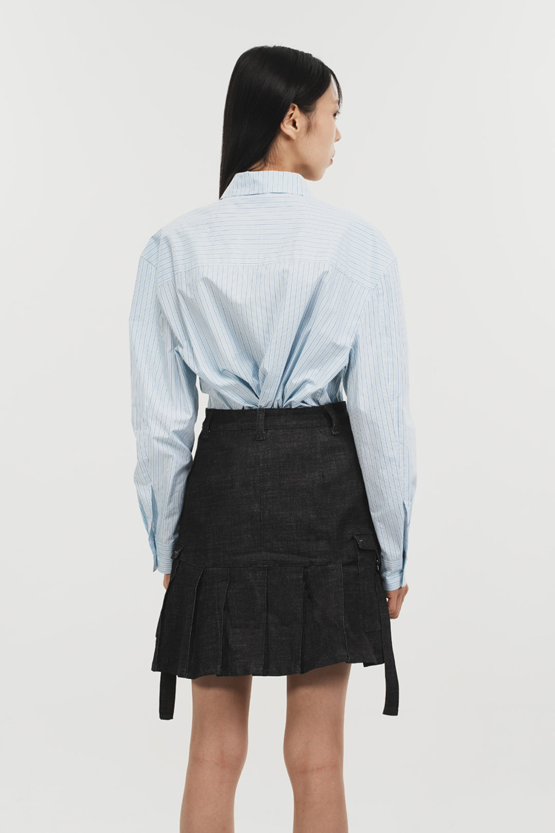 Charcoal denim pleats skirt by Phenomenon Seeper, featuring a stylish, structured design and knee-length cut.