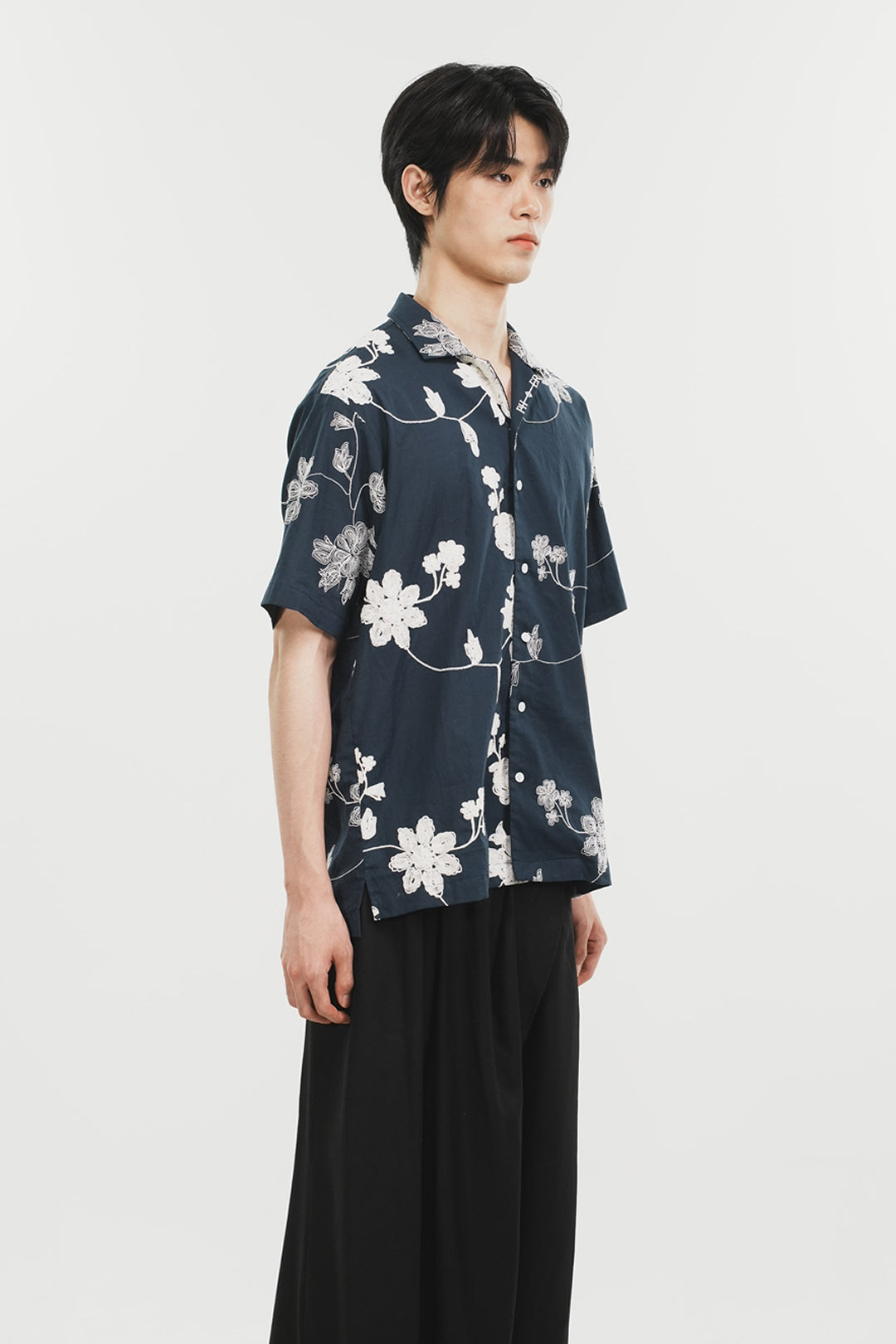 Navy Phenomenon Seeper Unbalance Flower Half Shirt with short sleeves and unique floral pattern, casual and stylish for men.