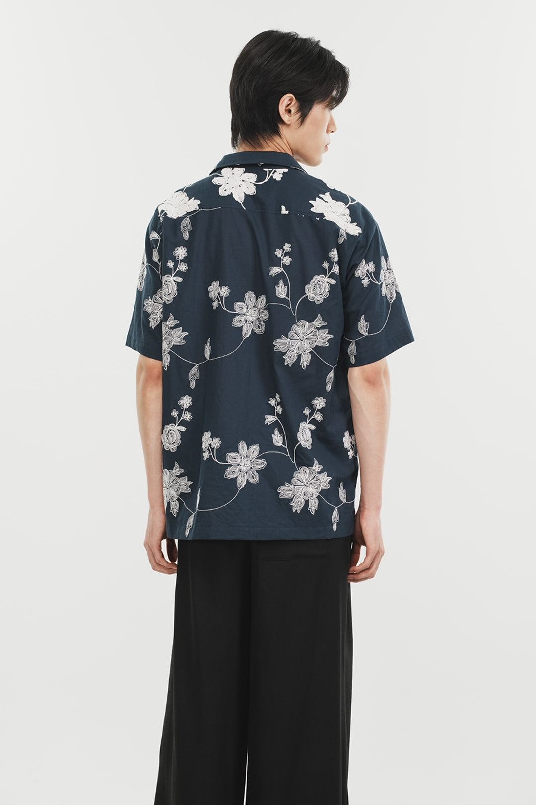 Navy Phenomenon Seeper Unbalance Flower Half Shirt for women, featuring a relaxed fit and floral design on lightweight fabric.