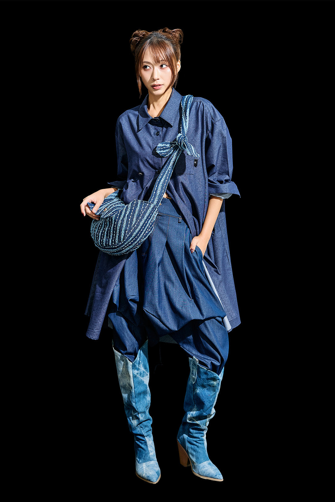Blue denim mini bag by Reculer with lace trim, featuring a compact design and adjustable strap for casual style.