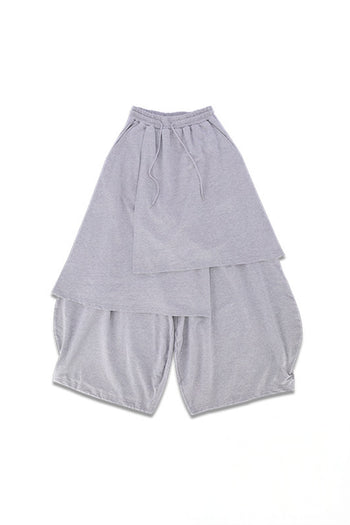 Reculer grey sweat skirt pants, casual bottoms, featuring a relaxed fit and comfortable fabric, shown on a neutral background.