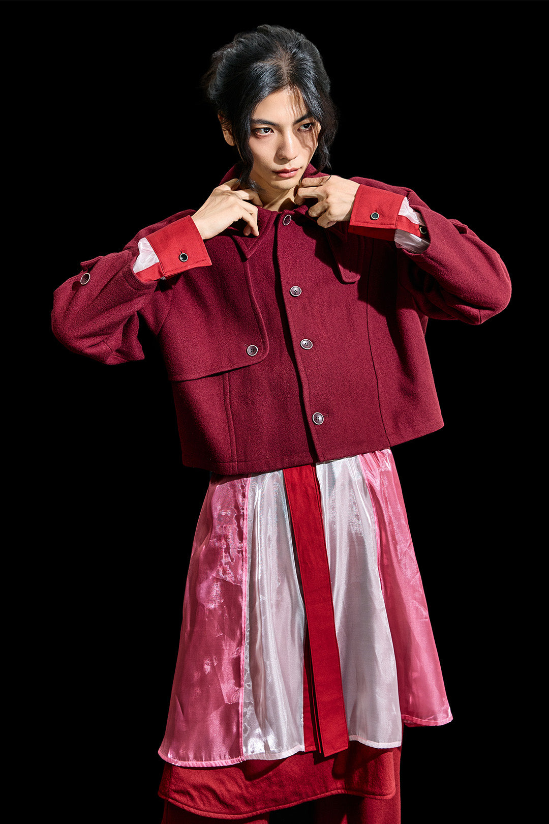 Reculer burgundy Reglan trench cropped wool coat displayed on a hanger, showcasing its tailored design and rich color.