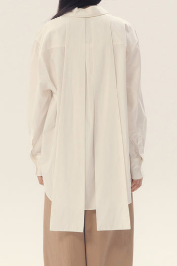 White Ribbon Back Ribbon Shirt by EUNJO, featuring a stylish ribbon detail on the back and a classic shirt design.