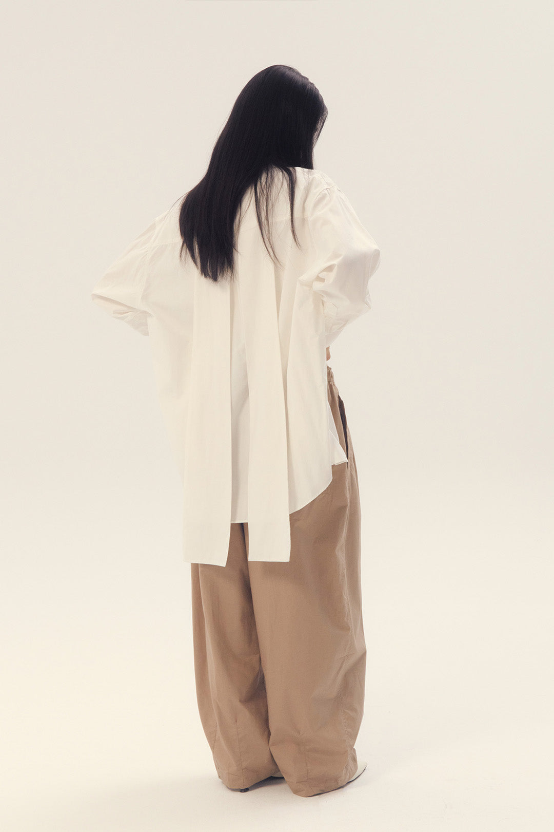 White Ribbon Back Ribbon Shirt by EUNJO, featuring a stylish ribbon detail at the back and classic shirt design.