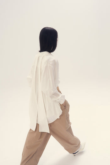 White Ribbon Back Ribbon Shirt by EUNJO, featuring a stylish ribbon detail on the back, perfect for casual or dressy occasions.