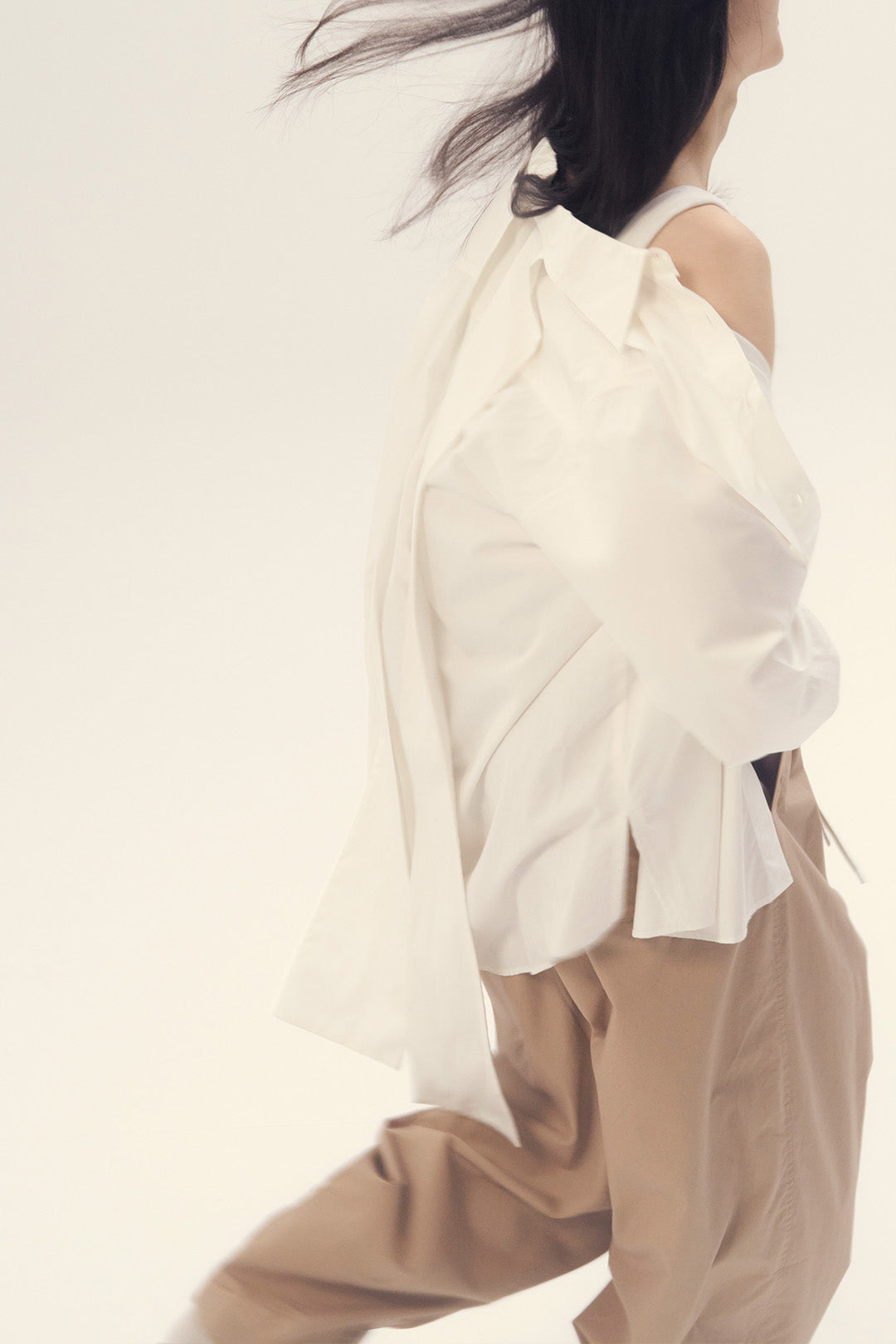 White Ribbon Back Ribbon Shirt by EUNJO, stylish casual shirt featuring a bow-tie back detail and classic design.