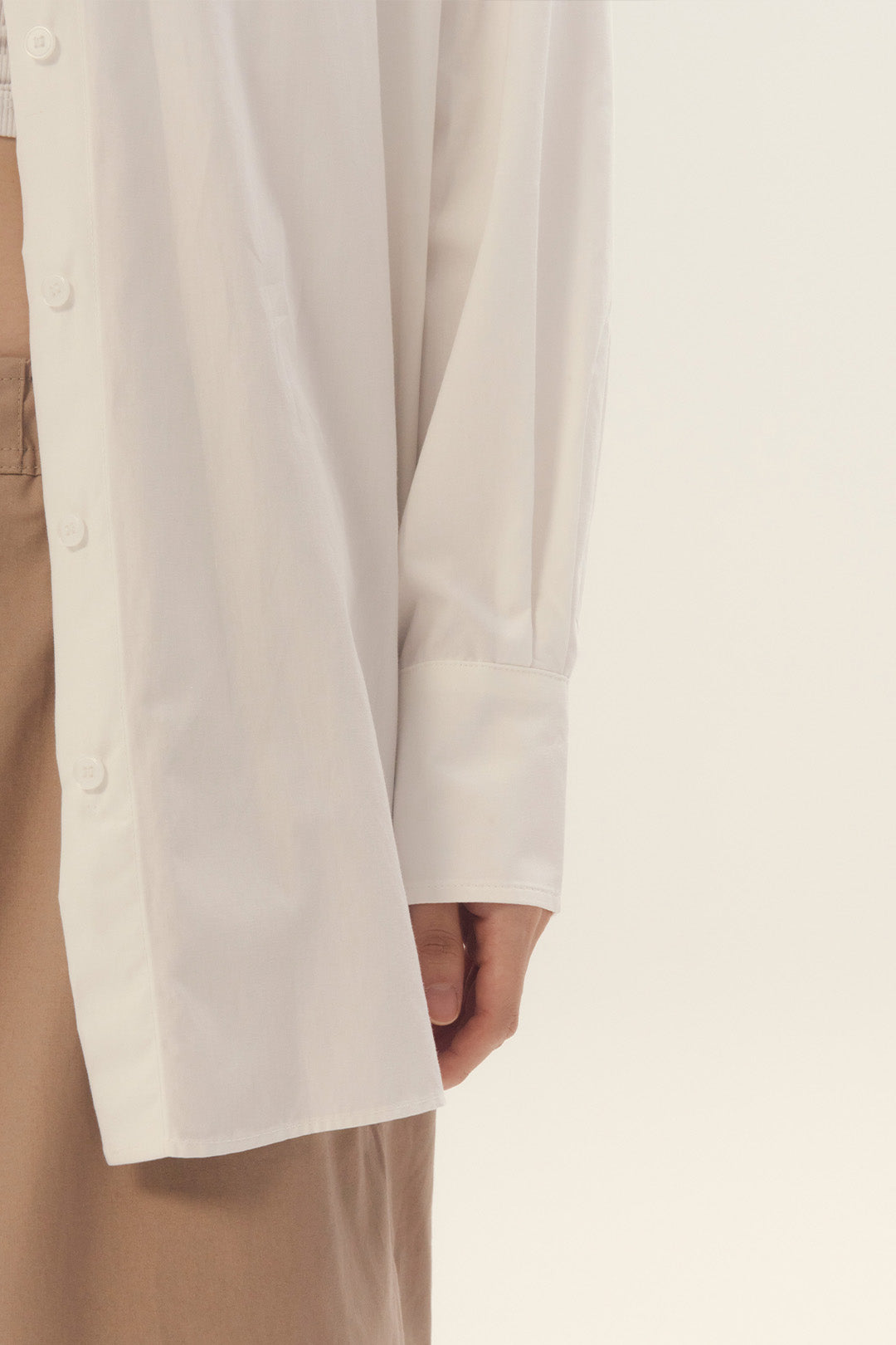 EUNJO white ribbon-back shirt featuring a stylish ribbon detail on the back, perfect for casual or dressy occasions.