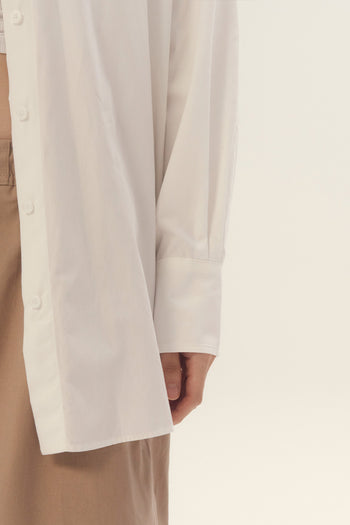 EUNJO white ribbon-back shirt featuring a stylish ribbon detail on the back, perfect for casual or dressy occasions.