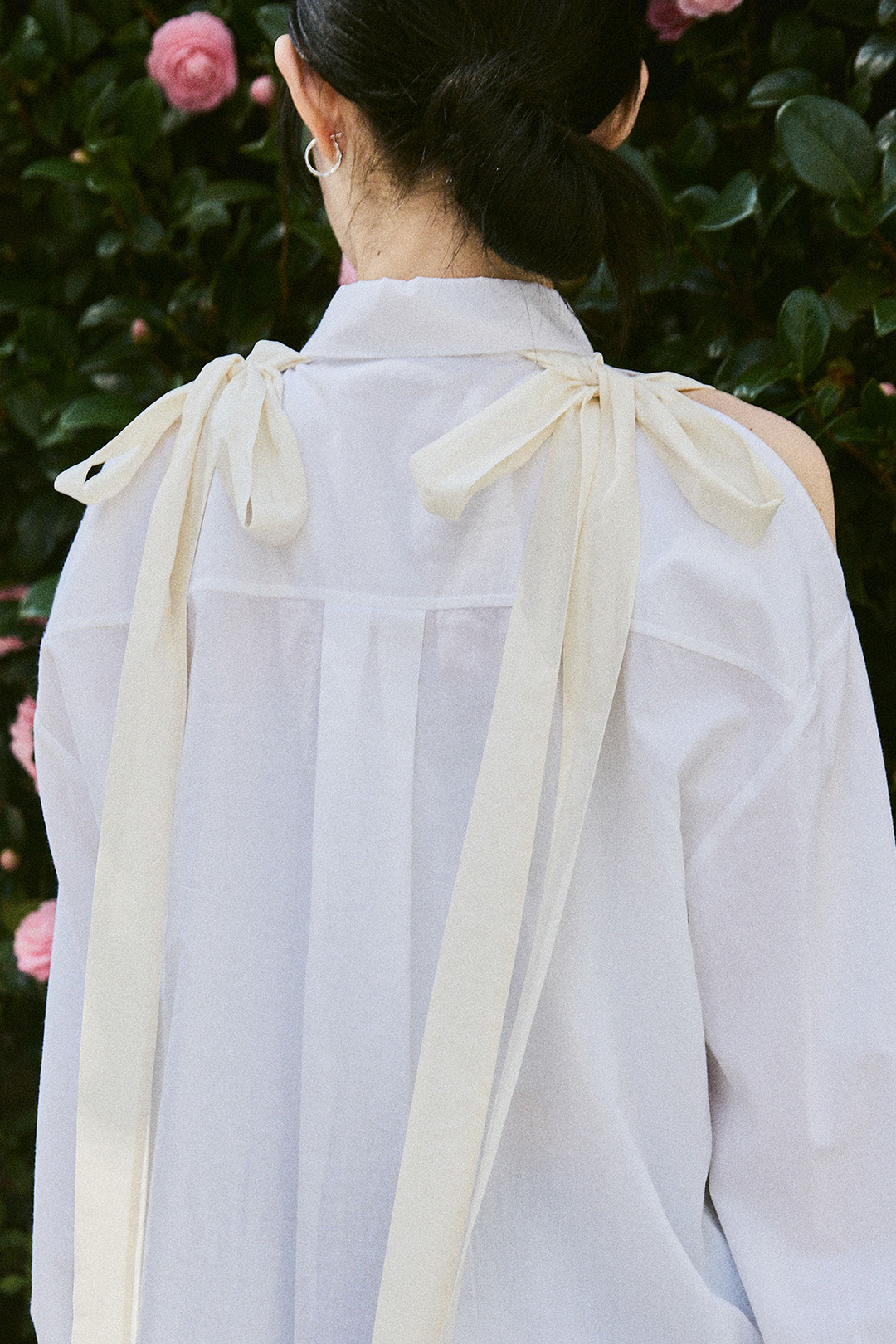 White Ribbon Wings Ribbon Shirt by EUNJO featuring a stylish design with ribbon accents and a comfortable fit.