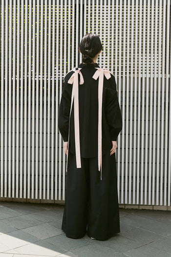 Black Ribbon Wings Ribbon Shirt by EUNJO featuring a stylish ribbon detail and classic shirt silhouette.