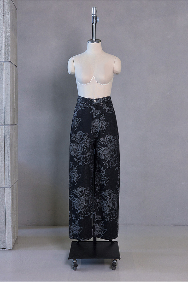 Black wash denim pants with dragon print, TM3 brand bottoms featuring a stylish, bold design and comfortable fit.