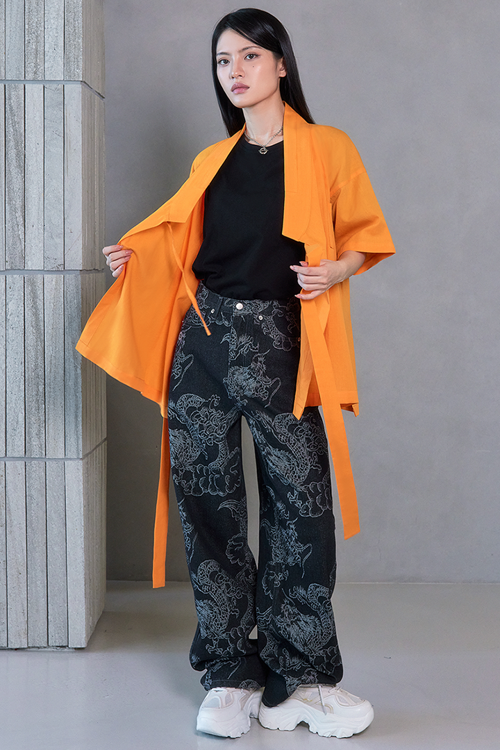 Black wash denim pants with dragon print from TM3, featuring a stylish and bold design for casual wear.