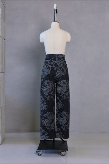 Black wash denim pants with dragon print from TM3, featuring a stylish bottom design and casual fit.
