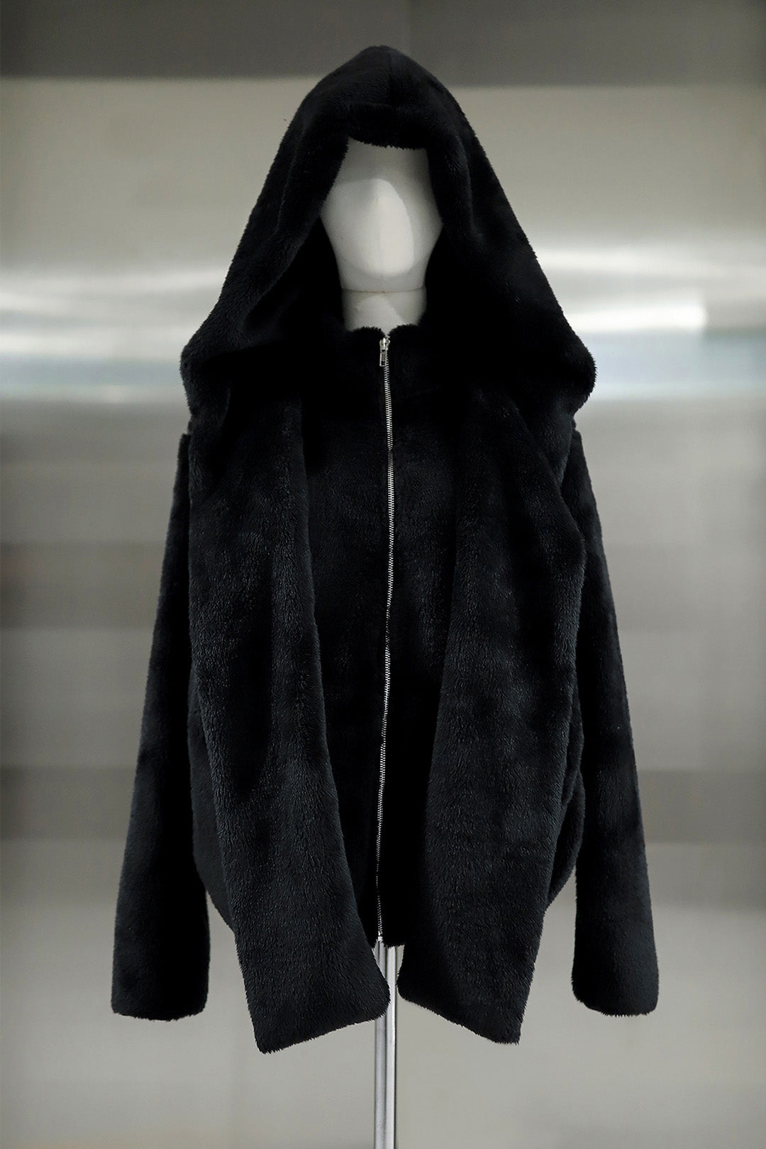 Black TM3 Balaclava Fleece Hoodie with hood and full-face coverage, made from warm, soft fleece material.