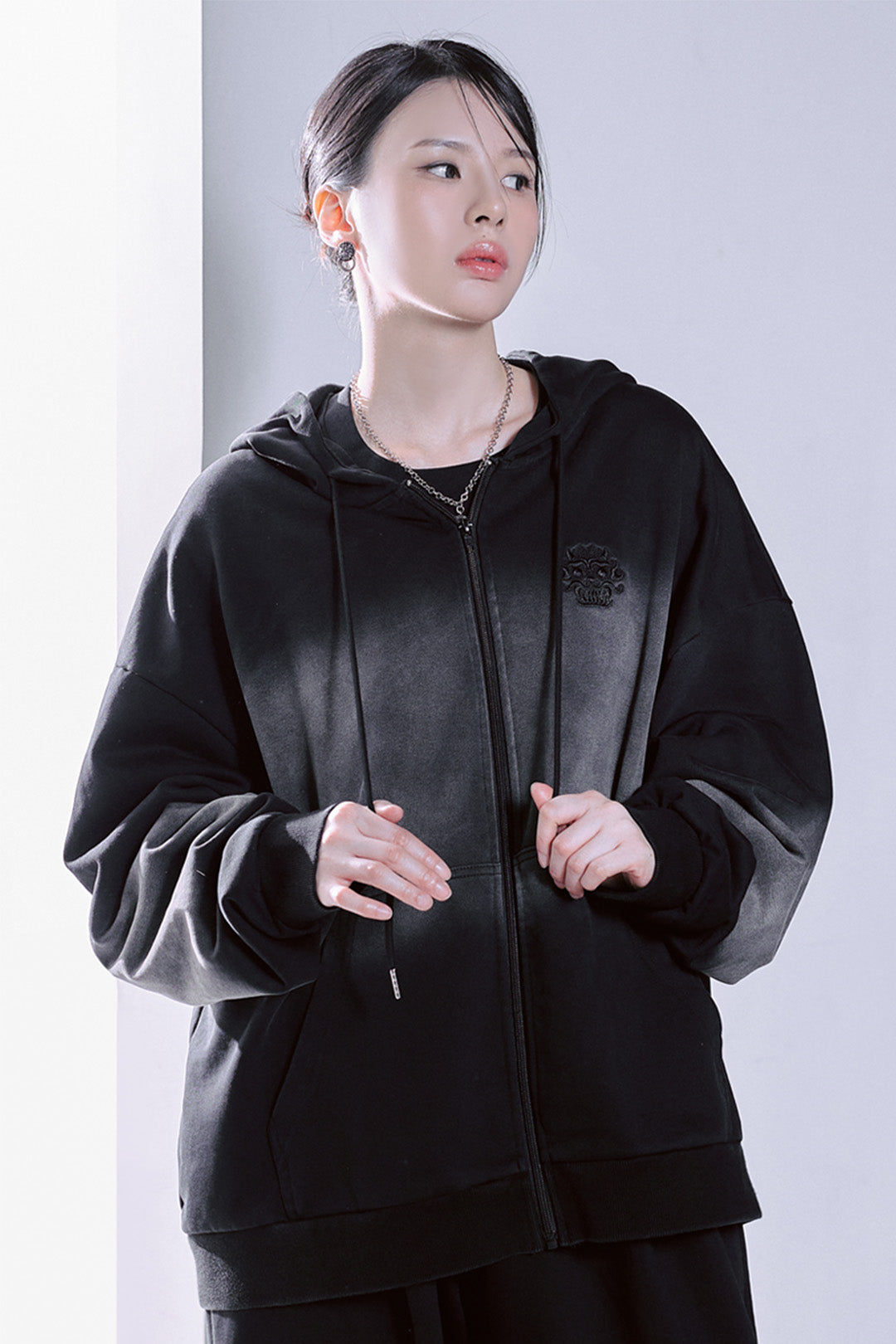Black TM3 Korean Dokkaebi Heukgwi gradient wash embroidered zip-up hoodie with logo and unisex fit, casual streetwear style.