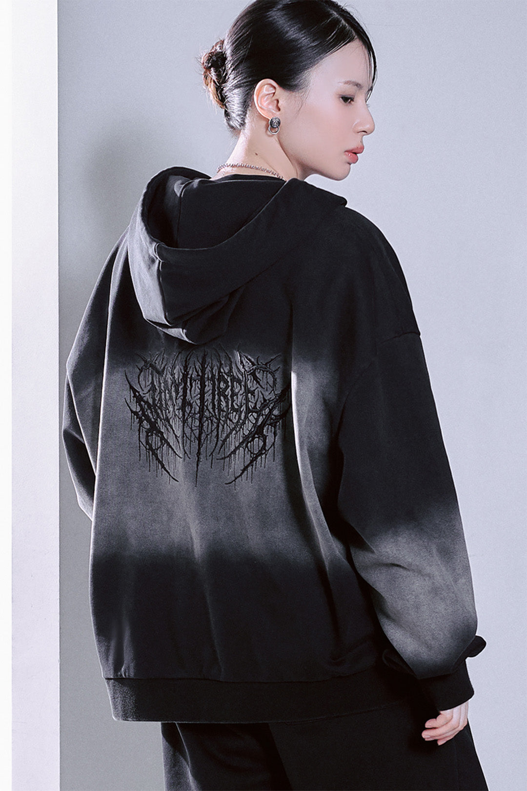 Black TM3 Korean Dokkaebi Heukgwi gradient wash embroidered zip-up hoodie, unisex style with logo design and cozy fit.