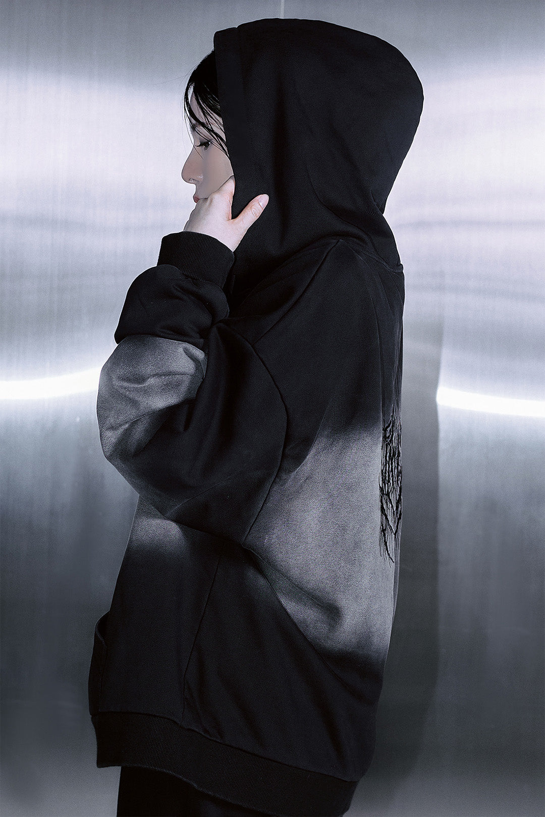 Black TM3 Korean Dokkaebi Heukgwi gradient wash logo unisex embroidered zip-up hoodie with detailed design and logo embroidery.
