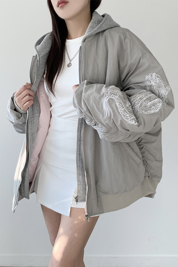 White bomber jacket by TM3 with beige and grey dragon embroidery, featuring a stylish casual design.