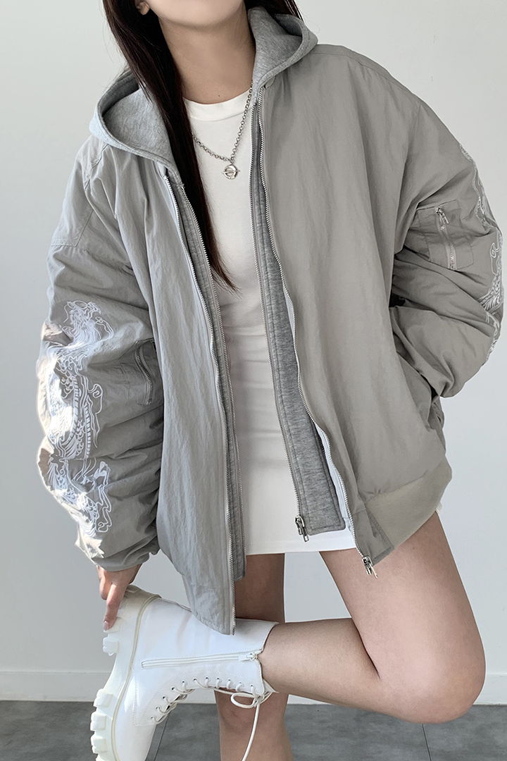 White and grey bomber jacket with beige accents featuring intricate white dragon embroidery, by TM3.