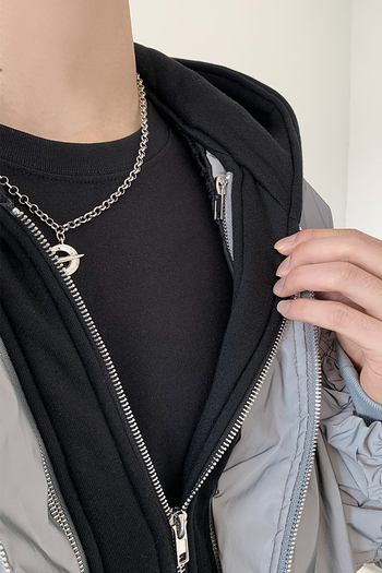 Black TM3 bomber jacket with grey dragon embroidery and reflective accents, featuring a sleek design and zip-up front.