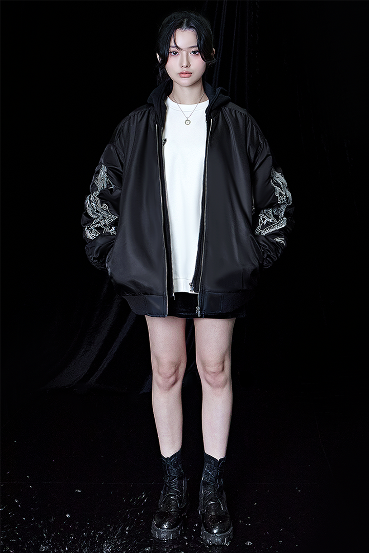 Black TM3 bomber jacket featuring detailed dragon embroidery, with a sleek design and ribbed cuffs and collar.